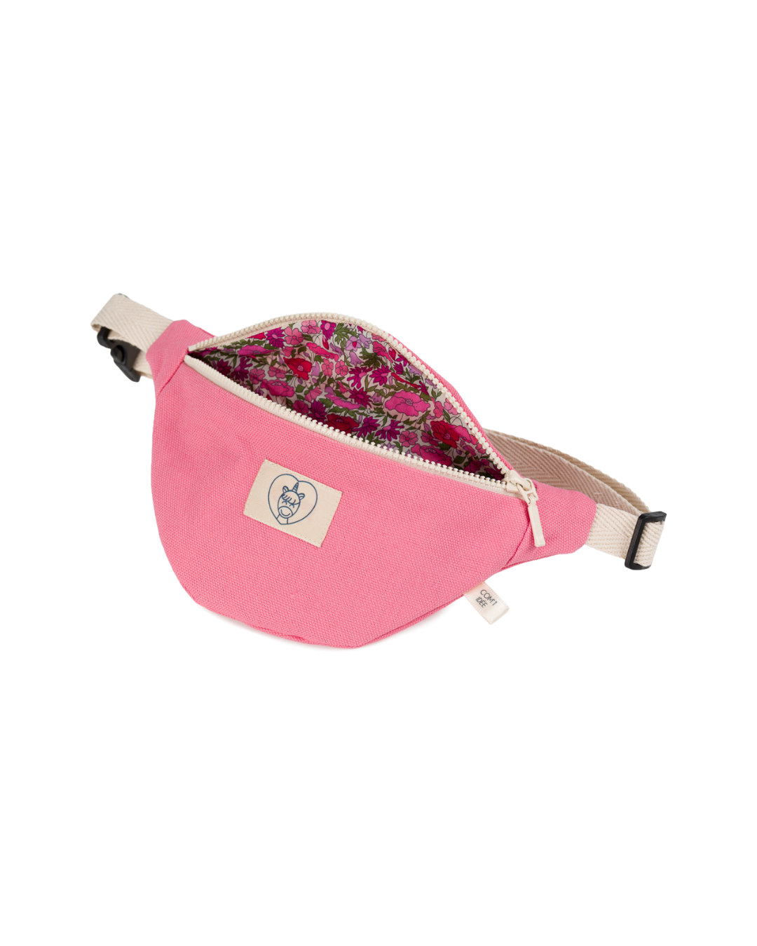 Sac banane enfant Mélo rose ouvert révélant sa doublure Liberty à fleurs roses.