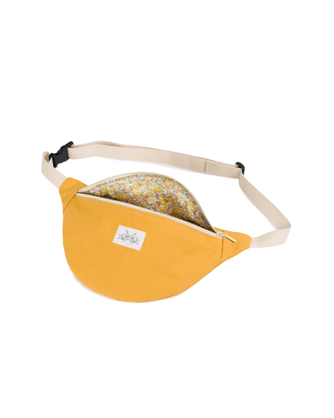 Sac banane M Solal ouvert montrant l’intérieur doublé en tissu Liberty fleuri.